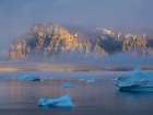 Midnight sun at Storoen Island. Uummannaq Fjord, northwest of Greenland beyond the arctic circle. Art Print